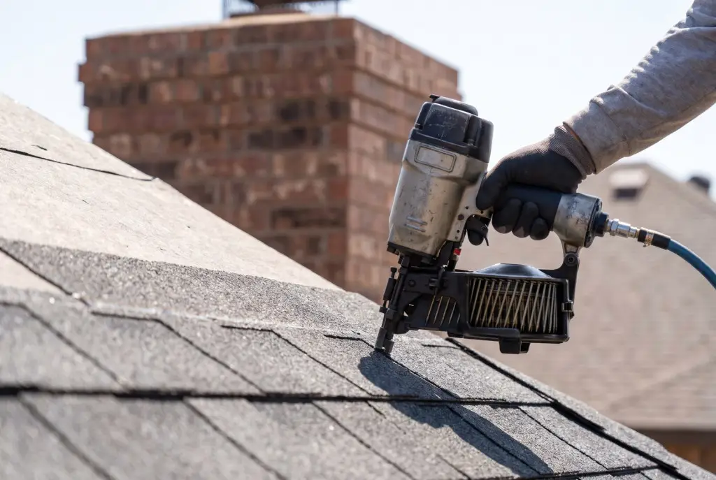 The best roof shingles for Lubbock installed on a modern brick home, impact-resistant Class 4 architectural shingles