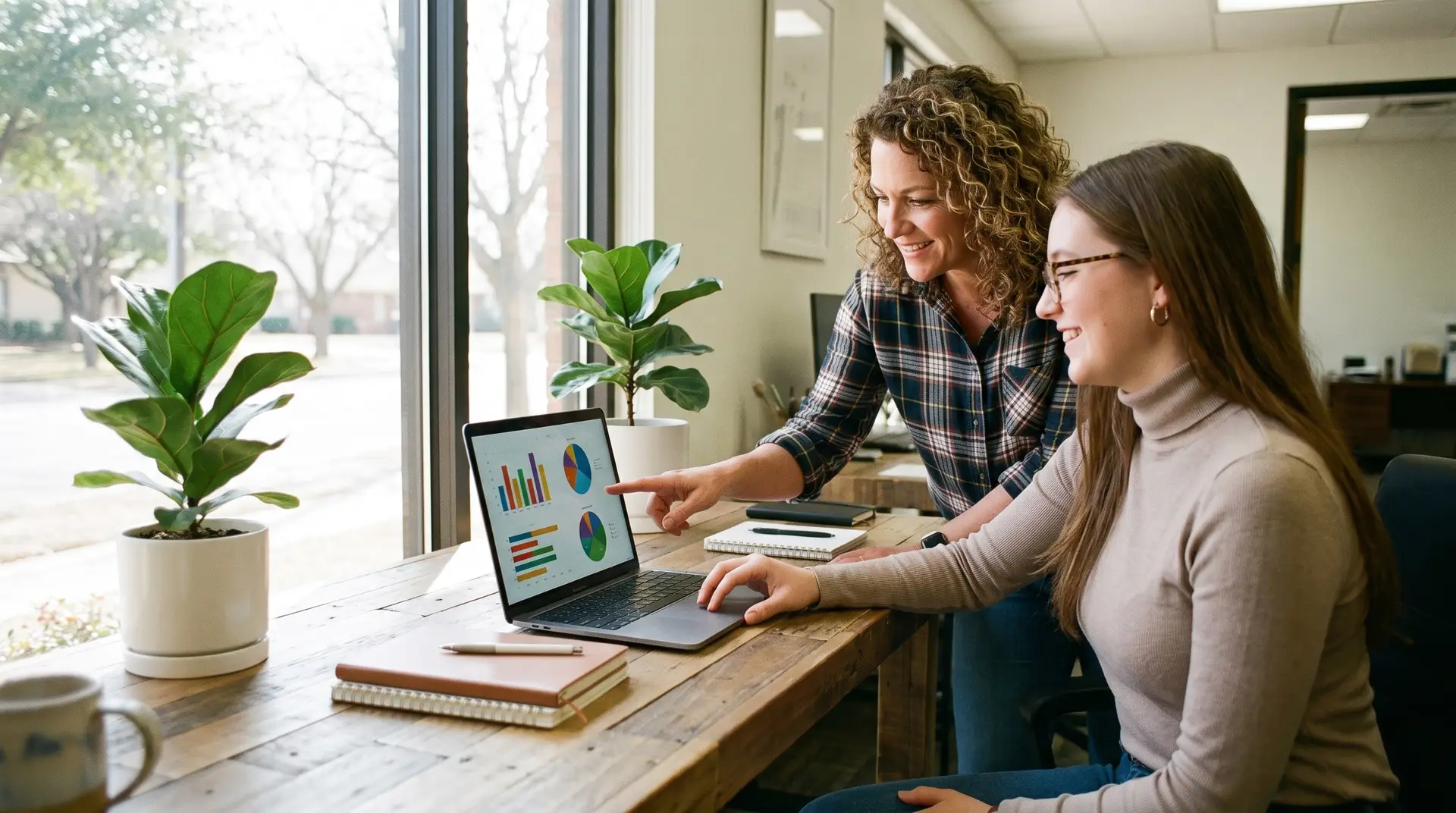 Lubbock small-business owner and marketer reviewing a digital marketing plan on a laptop in a bright modern office